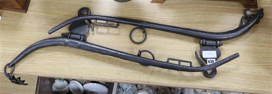 A pair of Victorian black painted wrought iron horse hames, length 82cm
